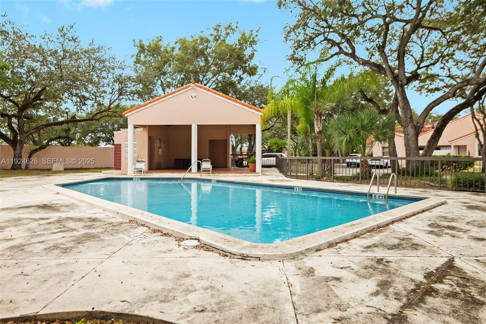 11840 Southwest 80th Street, Unit 526 Miami, FL 33183 - Photo 25 of 25 swimming pool view with a seating space
