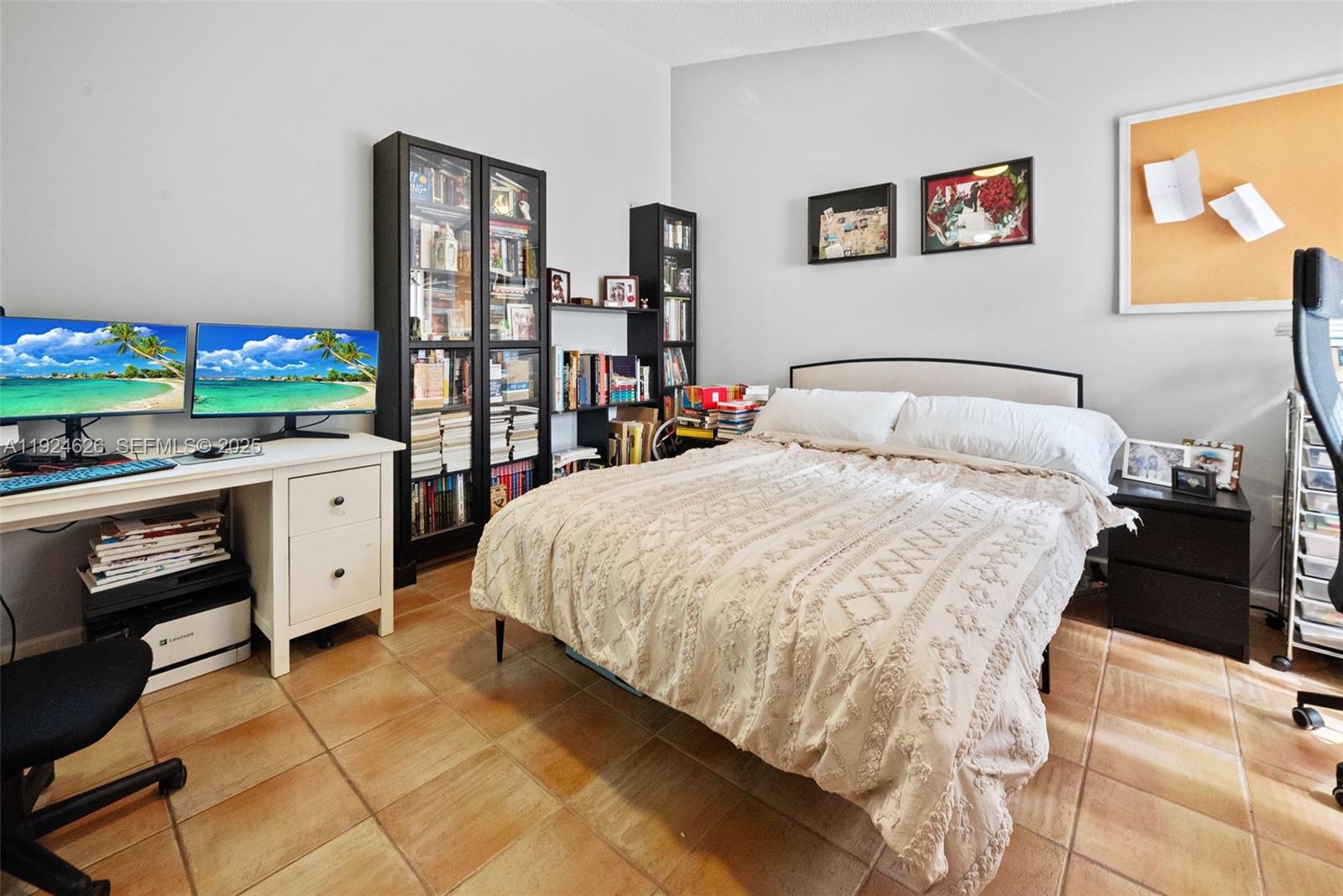11840 Southwest 80th Street, Unit 526 Miami, FL 33183 - Photo 9 of 25 a bed room with a bed and a television