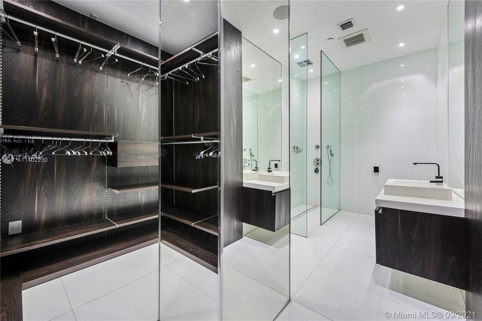 900 Brickell Key Boulevard, Unit 2902 Miami, FL 33131 - Photo 11 of 32 a bathroom with a sink a toilet and shower