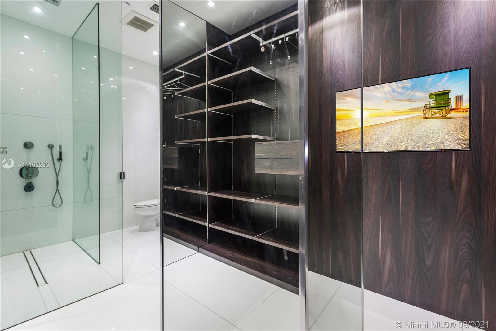 900 Brickell Key Boulevard, Unit 2902 Miami, FL 33131 - Photo 12 of 32 a bathroom with a shower and a sink