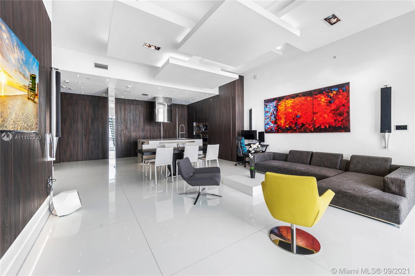 900 Brickell Key Boulevard, Unit 2902 Miami, FL 33131 - Photo 31 of 32 a living room with furniture and a flat screen tv