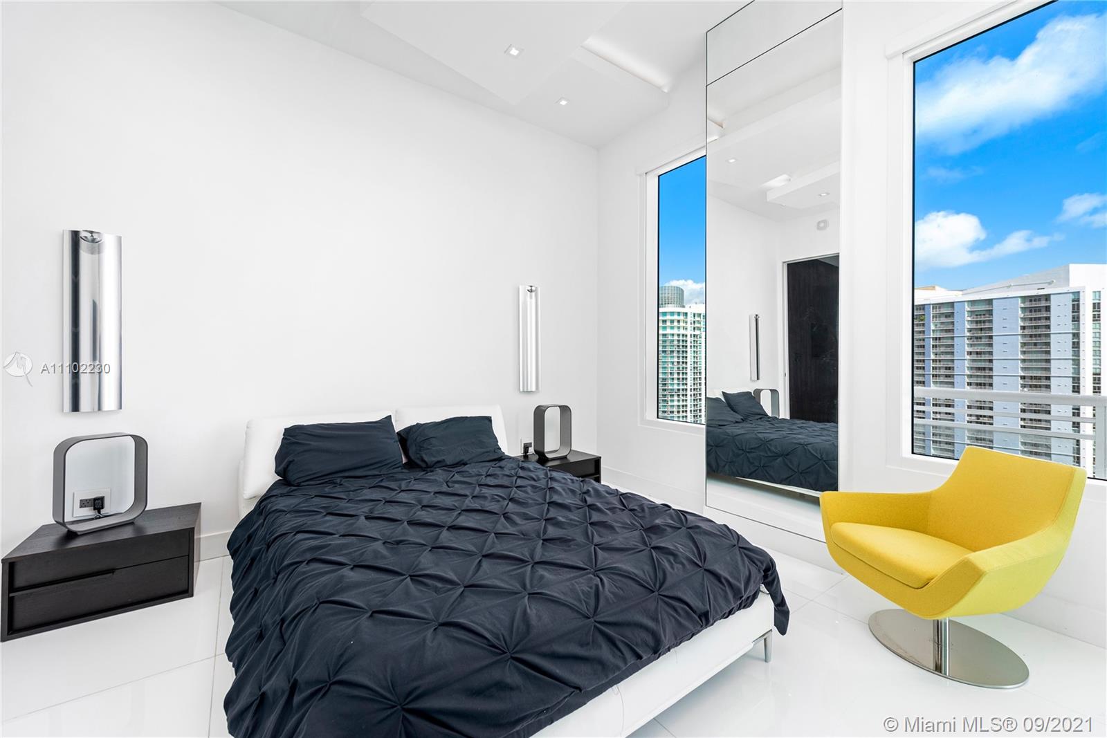 900 Brickell Key Boulevard, Unit 2902 Miami, FL 33131 - Photo 7 of 32 a bedroom with a bed and window