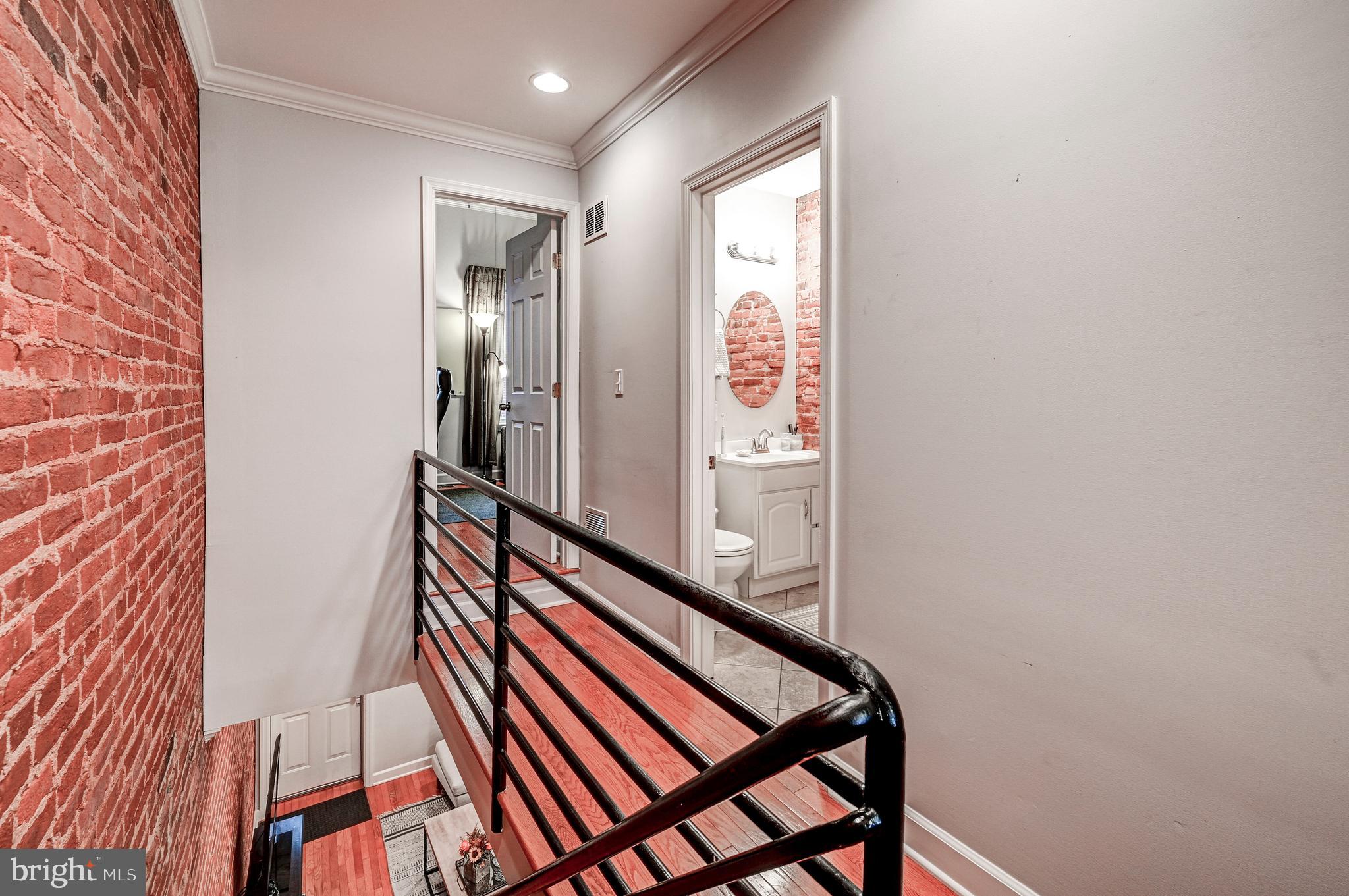 5 North Rose Street Baltimore, MD 21224 - Photo 17 of 31 Hall full bath with exposed brick