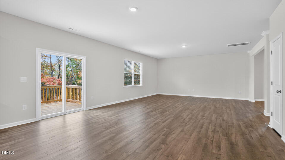 212 Calebs Cor Place Spring Lake, NC 28390 - Photo 16 of 45 a view of empty room with wooden floor and fan