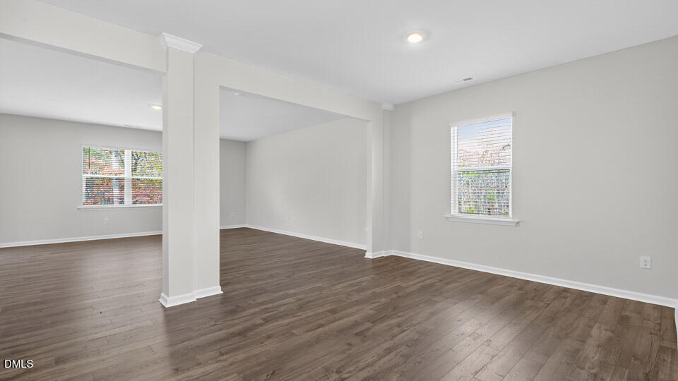 212 Calebs Cor Place Spring Lake, NC 28390 - Photo 17 of 45 an empty room with wooden floor and windows