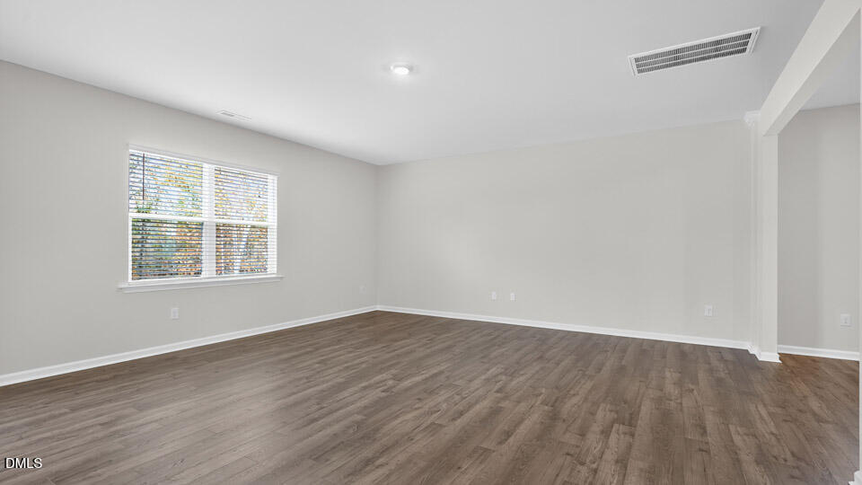 212 Calebs Cor Place Spring Lake, NC 28390 - Photo 18 of 45 wooden floor in an empty room with a window