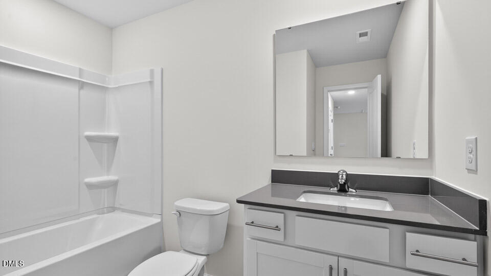 212 Calebs Cor Place Spring Lake, NC 28390 - Photo 32 of 45 a bathroom with a granite countertop sink toilet and shower