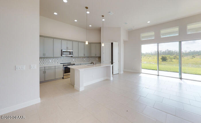 250 Azure Mist Way Daytona Beach, FL 32124 - Photo 8 of 28 8. Kitchen and Living