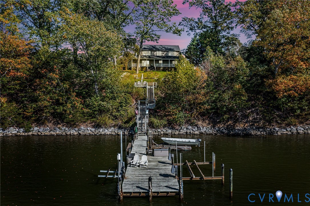 a balcony with table and chairs