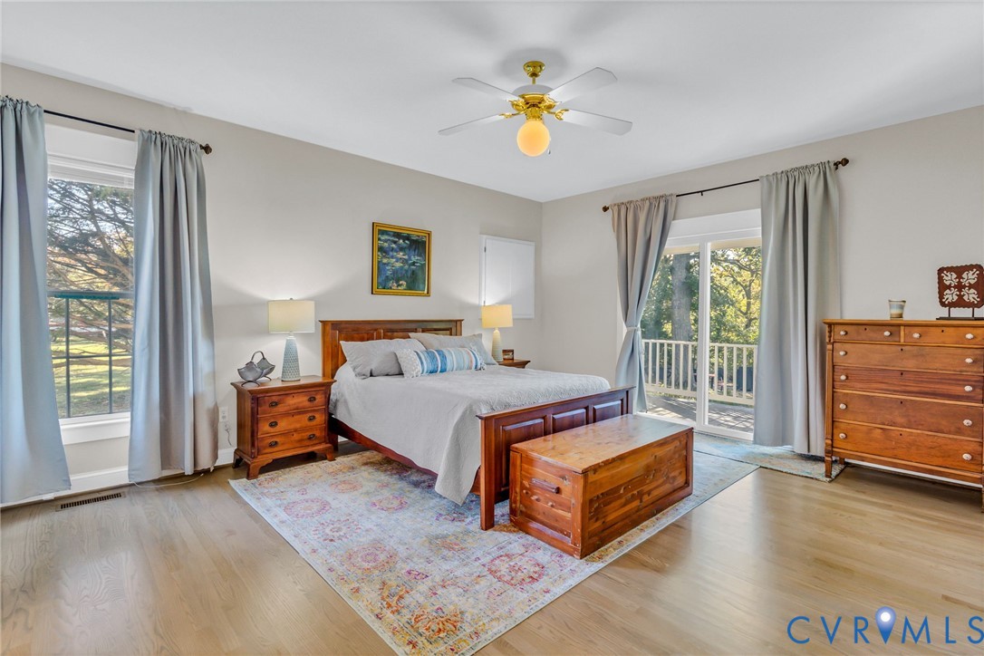 1248 Bancton Road Kinsale, VA 22488 - Photo 17 of 50 a bedroom with a bed and wooden floor