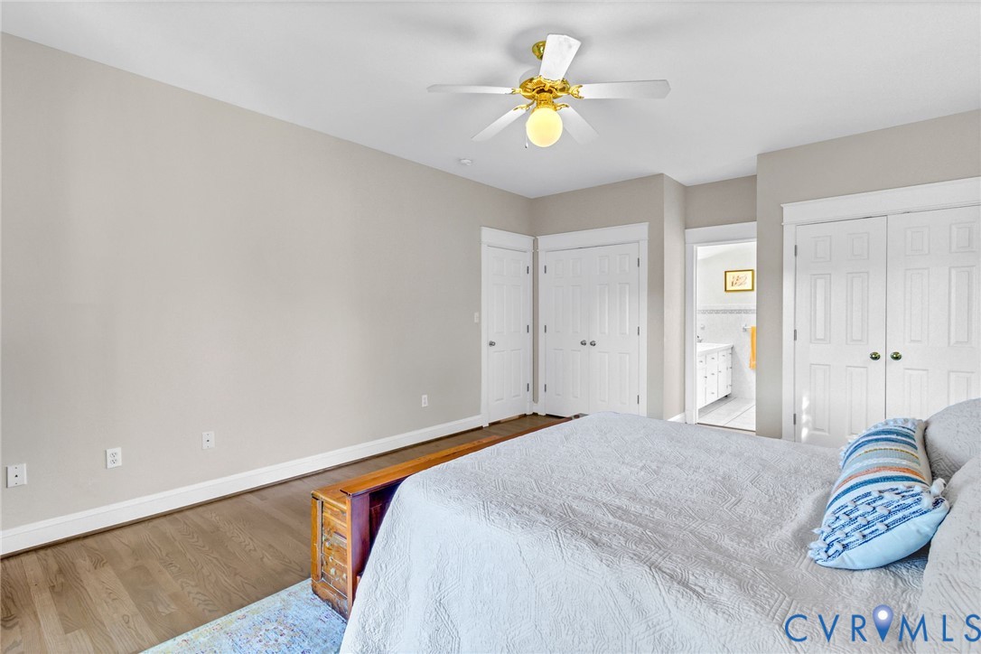 1248 Bancton Road Kinsale, VA 22488 - Photo 19 of 50 a bedroom with a bed and a chandelier