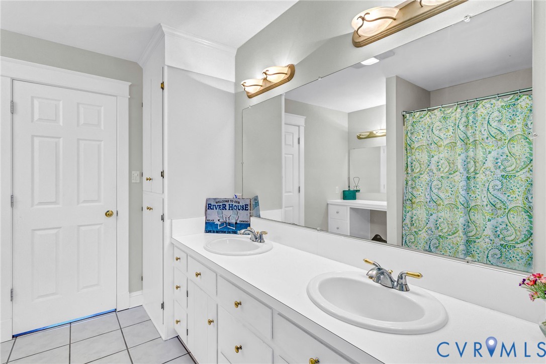 1248 Bancton Road Kinsale, VA 22488 - Photo 24 of 50 a bathroom with double sink and a mirror