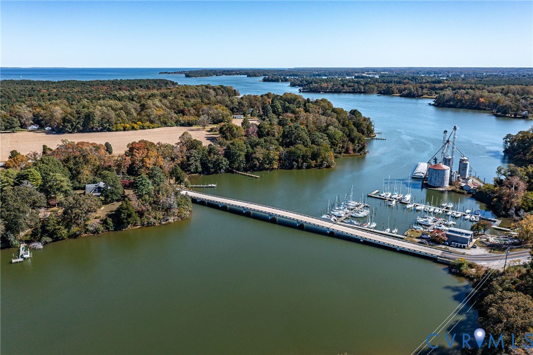1248 Bancton Road Kinsale, VA 22488 - Photo 37 of 50 a view of a lake with boats and trees in the background