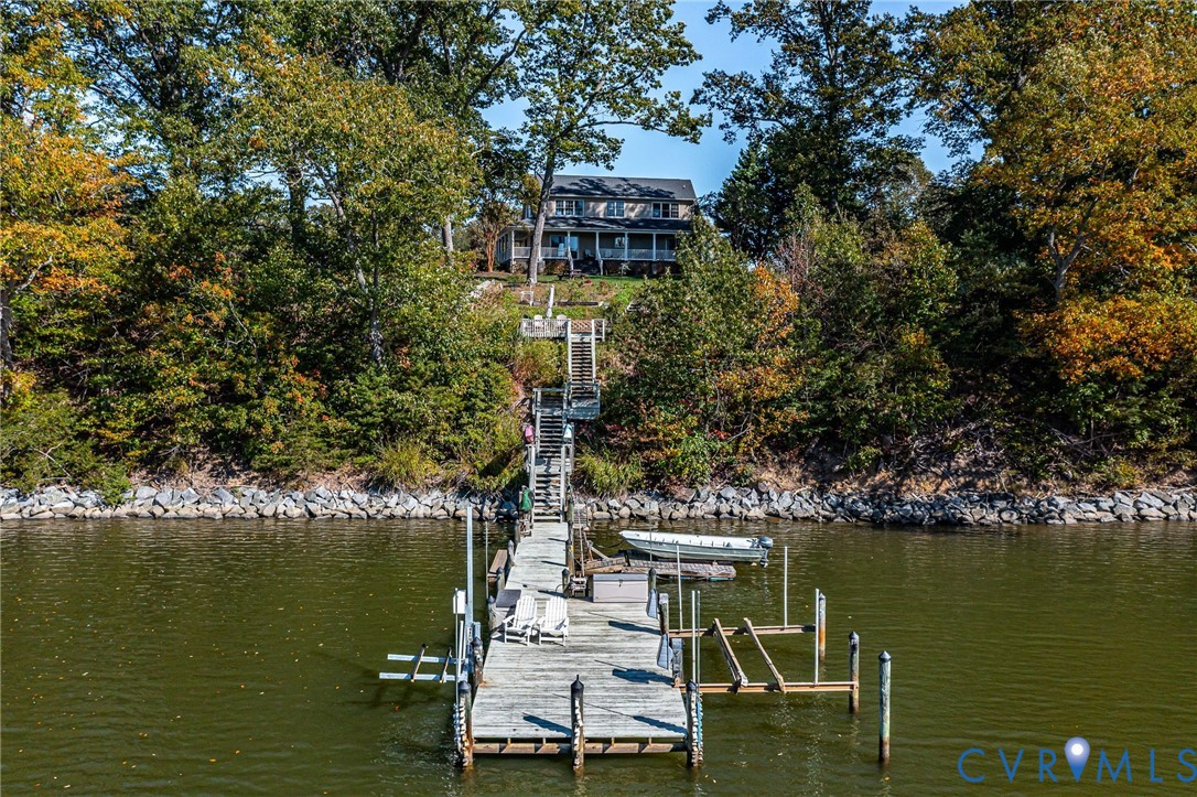 1248 Bancton Road Kinsale, VA 22488 - Photo 42 of 50 a view of a lake with a table and chairs next to an ocean