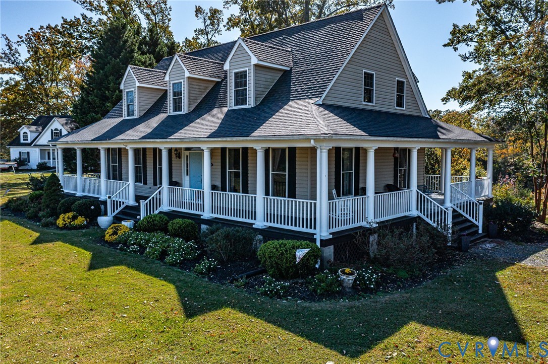 1248 Bancton Road Kinsale, VA 22488 - Photo 45 of 50 a front view of a house with a yard and potted plants
