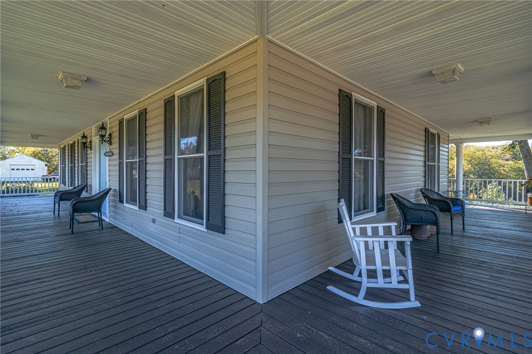 1248 Bancton Road Kinsale, VA 22488 - Photo 47 of 50 a balcony with chairs and wooden floor