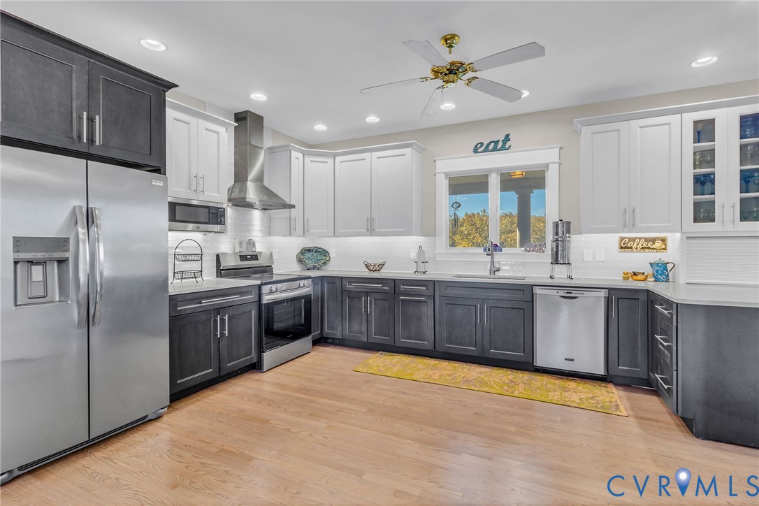 1248 Bancton Road Kinsale, VA 22488 - Photo 6 of 50 a kitchen with stainless steel appliances a sink a stove a refrigerator cabinets and entryway