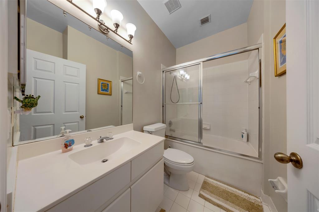 4115 Carriage Drive, Unit P2 Pompano Beach, FL 33069 - Photo 18 of 21 a bathroom with a sink a toilet and shower