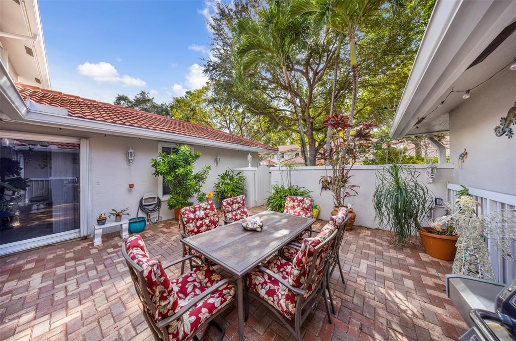 4115 Carriage Drive, Unit P2 Pompano Beach, FL 33069 - Photo 2 of 21 a outdoor space with furniture
