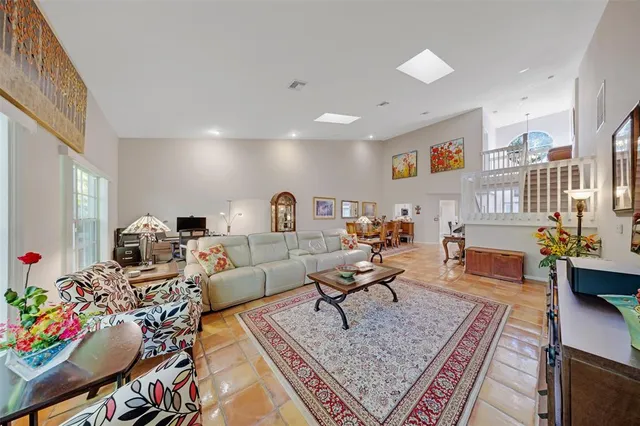 a living room with furniture and a rug