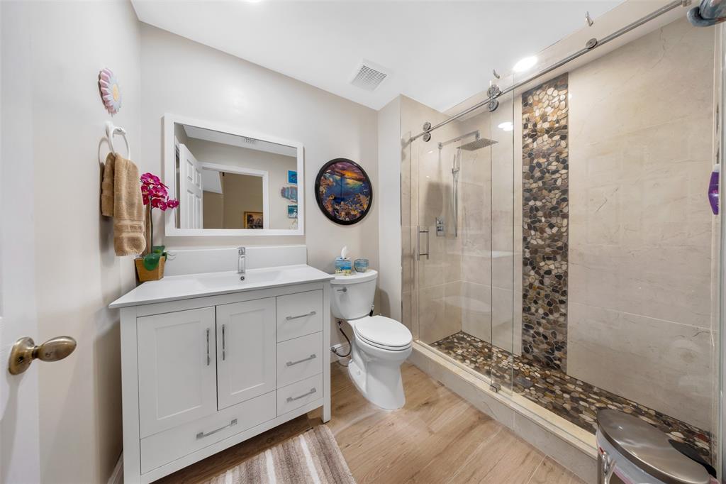 4115 Carriage Drive, Unit P2 Pompano Beach, FL 33069 - Photo 10 of 21 a bathroom with a toilet a sink and a shower