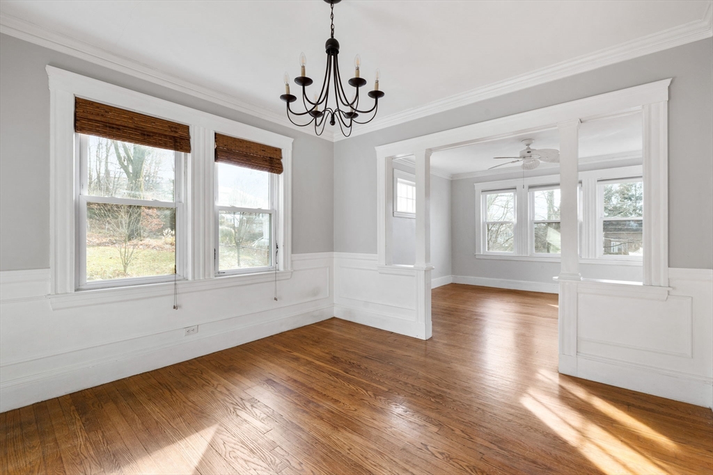 18-20 Pond Street Boston, MA 02136 - Photo 3 of 15 a view of an empty room with wooden floor and a window