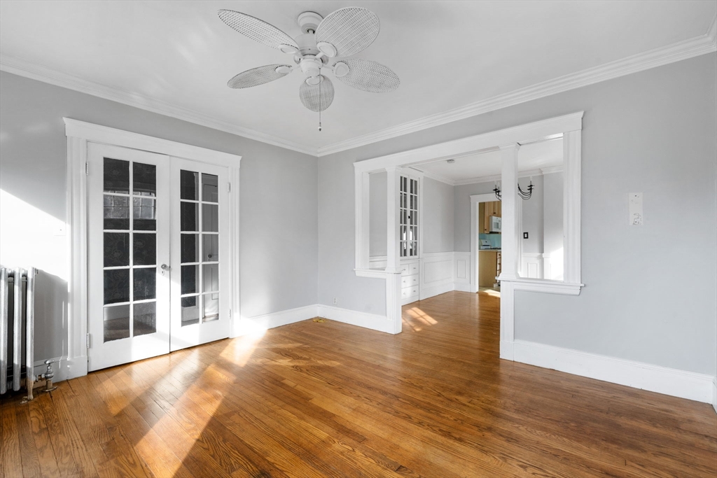 18-20 Pond Street Boston, MA 02136 - Photo 5 of 15 a view of an empty room with wooden floor and a window