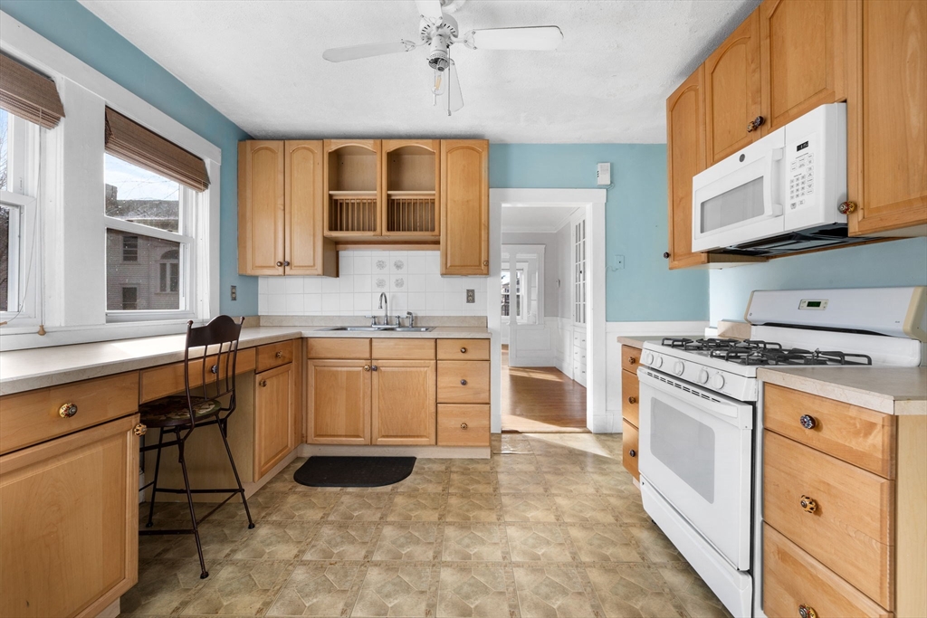 18-20 Pond Street Boston, MA 02136 - Photo 6 of 15 a kitchen with a stove a sink and a refrigerator