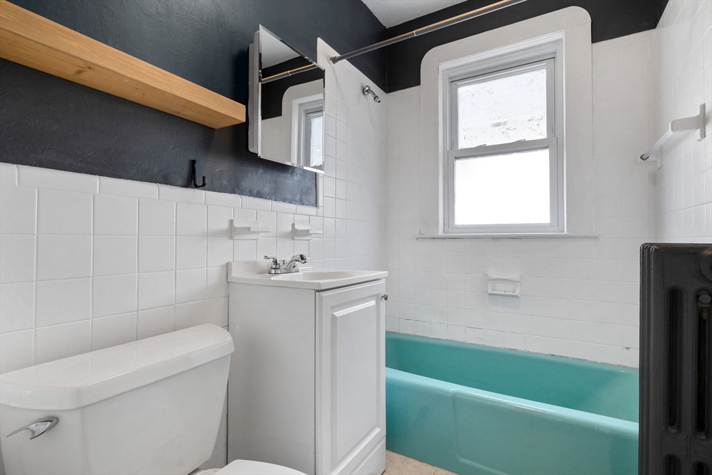 18-20 Pond Street Boston, MA 02136 - Photo 8 of 15 a bathroom with a sink a toilet and bathtub