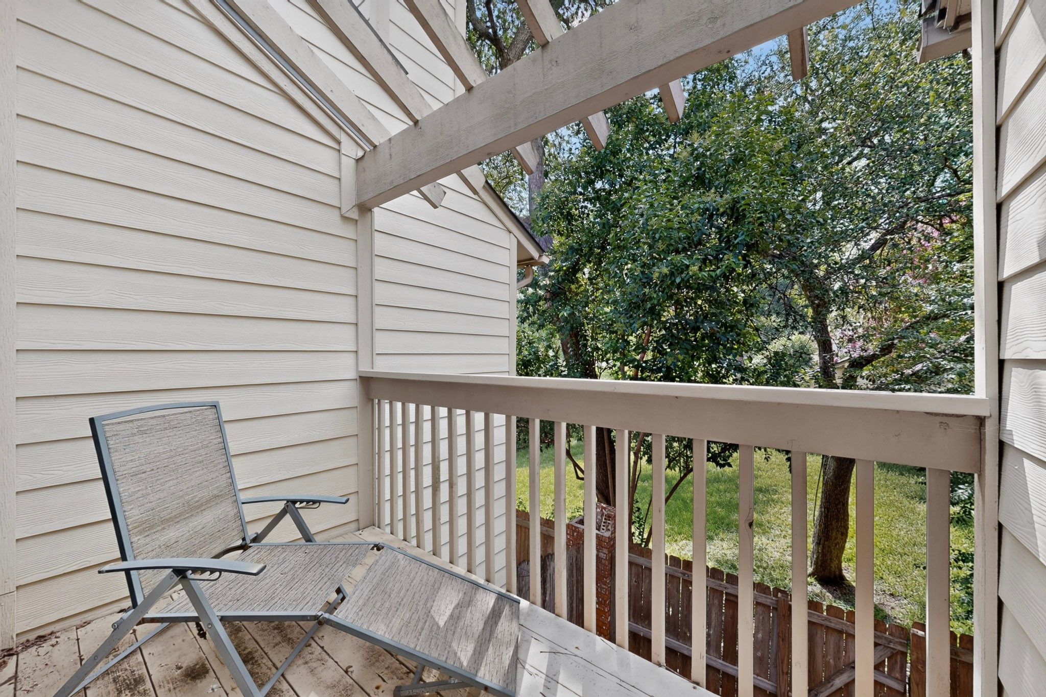 3801 Menchaca Road, Unit 25 Austin, TX 78704 - Photo 15 of 27 Balcony off primary bedroom overlooking community greenspace