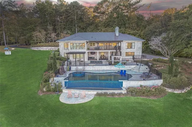 a front view of a house with a yard table and chairs