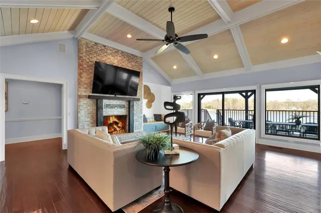 a living room with a bed furniture and a window