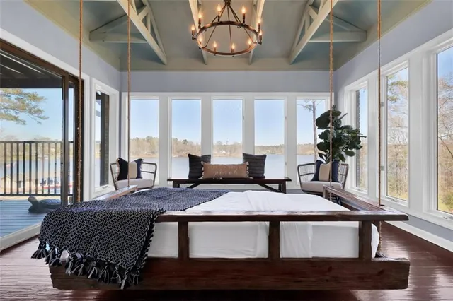 a kitchen with kitchen island a counter top space cabinets and stainless steel appliances