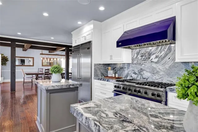 a view of living room with furniture and wooden floor