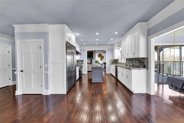 a living room with fireplace furniture and a flat screen tv