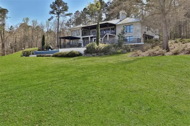 a view of bathroom with a sink and mirror