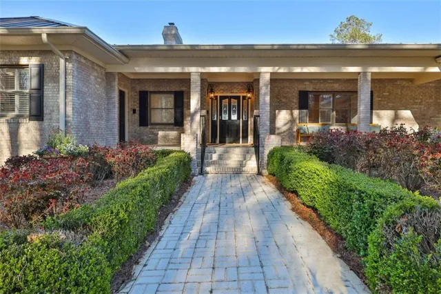 a view of a house with a backyard