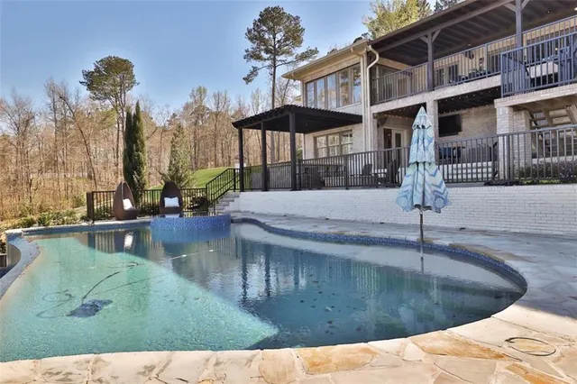 a outdoor living space with furniture and a wooden floor