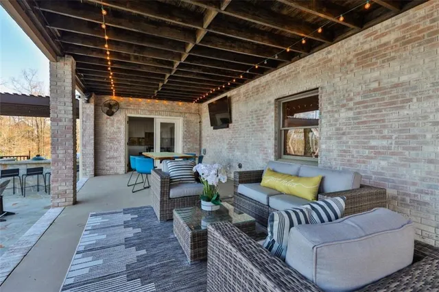 a view of balcony with wooden floor and outdoor seating