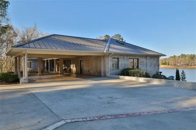 a bathroom with a granite countertop toilet a sink and a bathtub