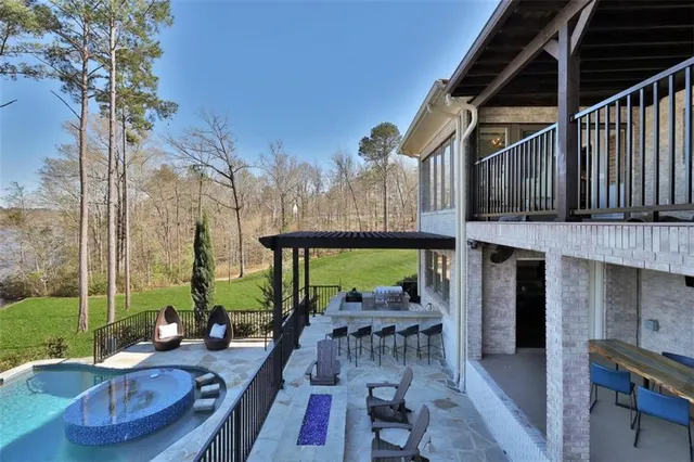 a spacious bedroom with a bed and wooden floor