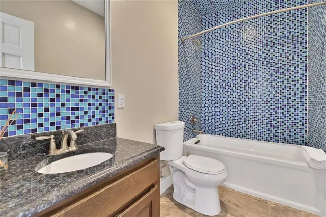 a spacious bedroom with a bed and furniture