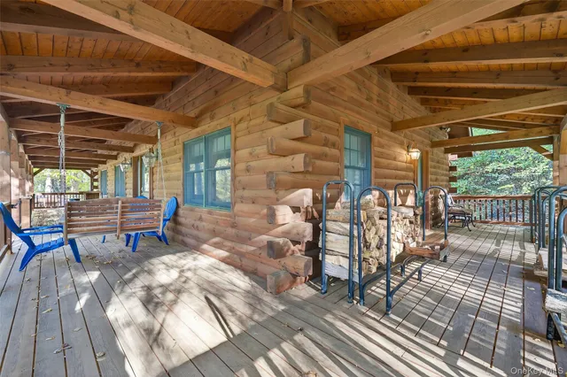 a living room with furniture a fireplace and wooden floor