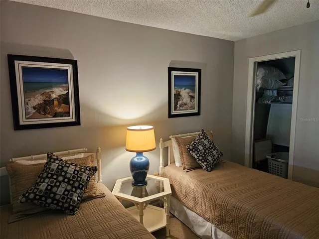 a bedroom with bed and window