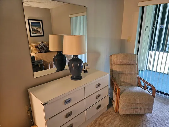 a living room with furniture and a lamp