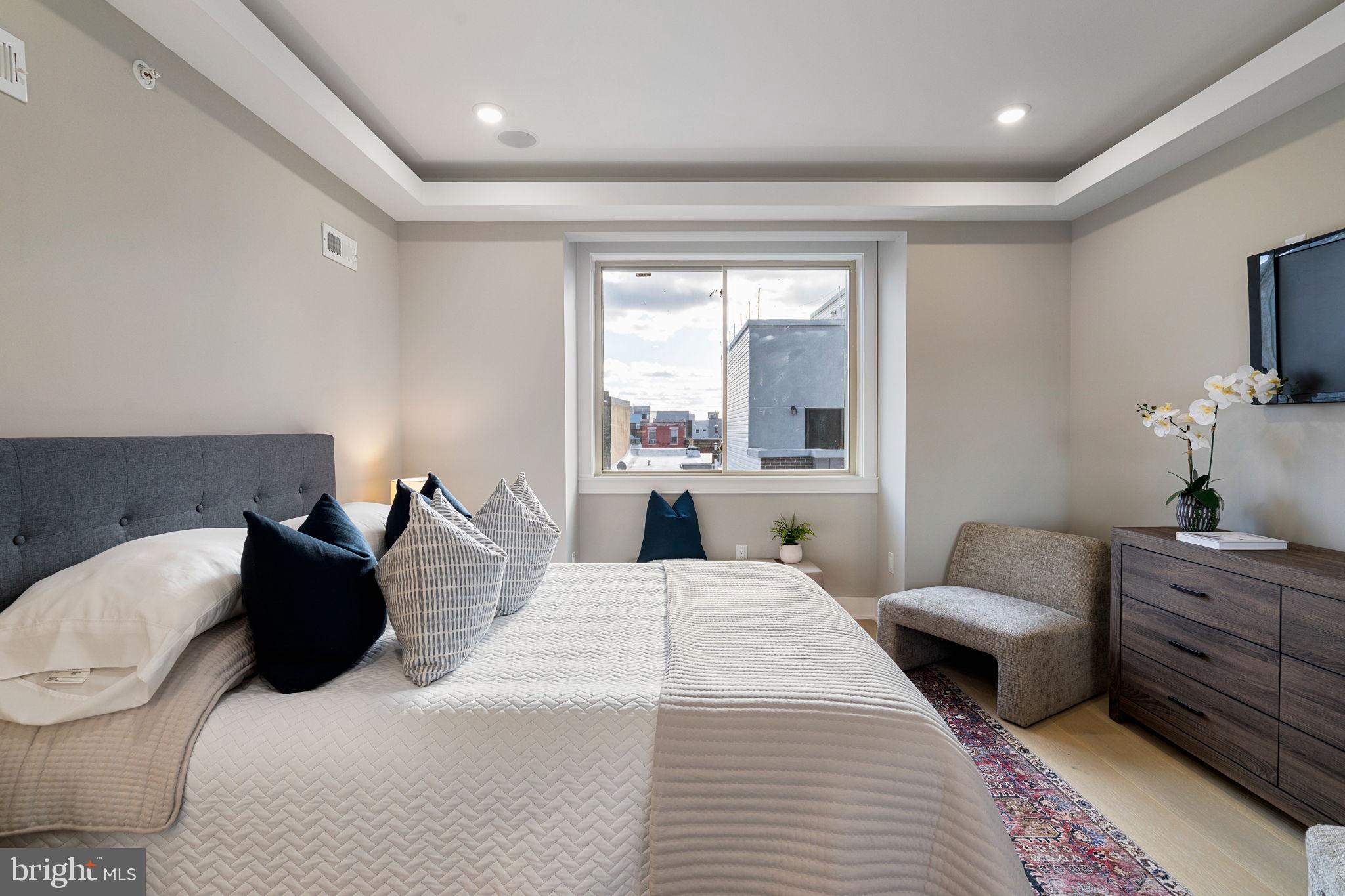 717 Mercy Street Philadelphia, PA 19148 - Photo 16 of 48 a bedroom with a bed and a couch