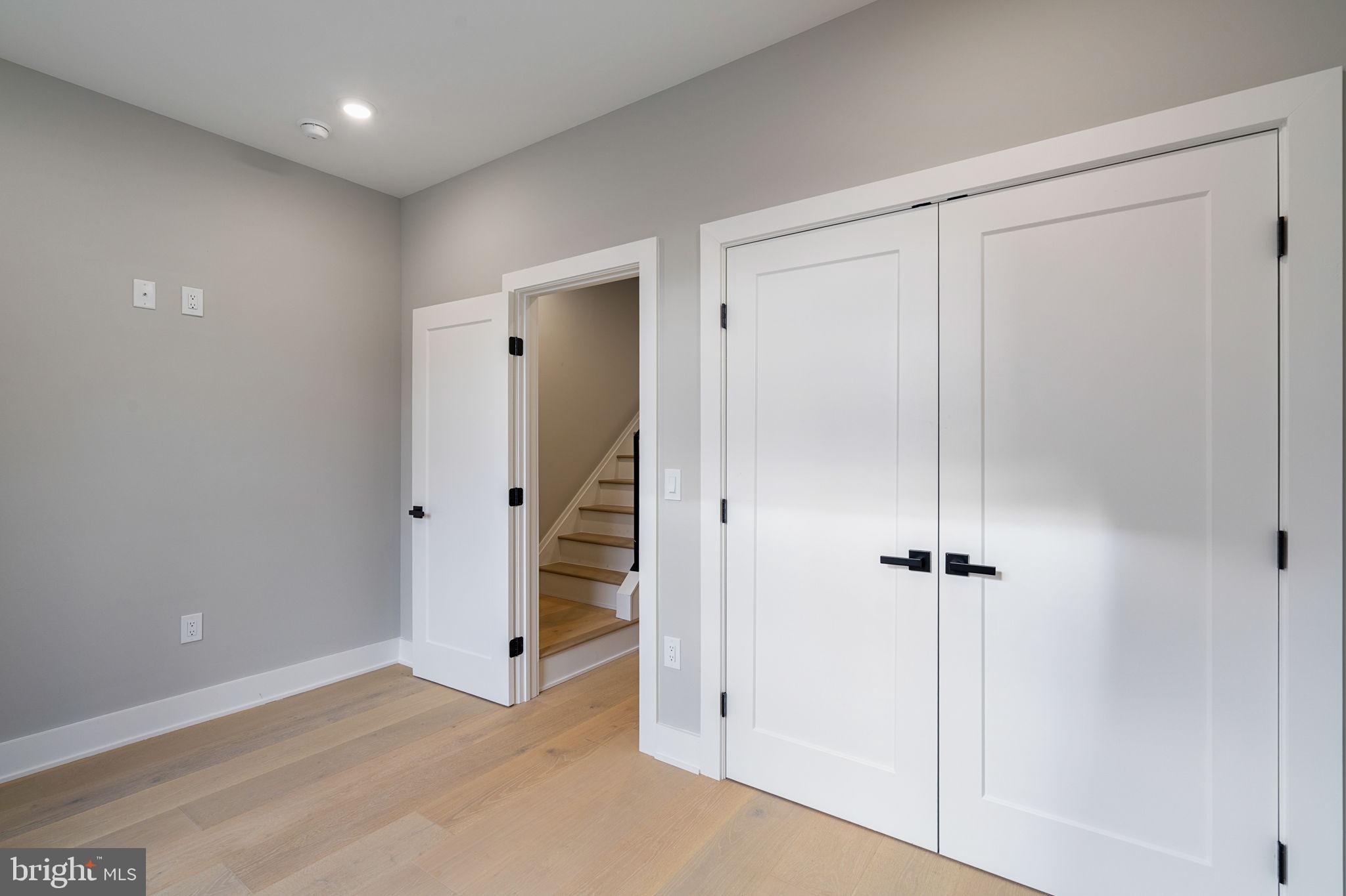 717 Mercy Street Philadelphia, PA 19148 - Photo 30 of 48 a view of a hallway with wooden shelves