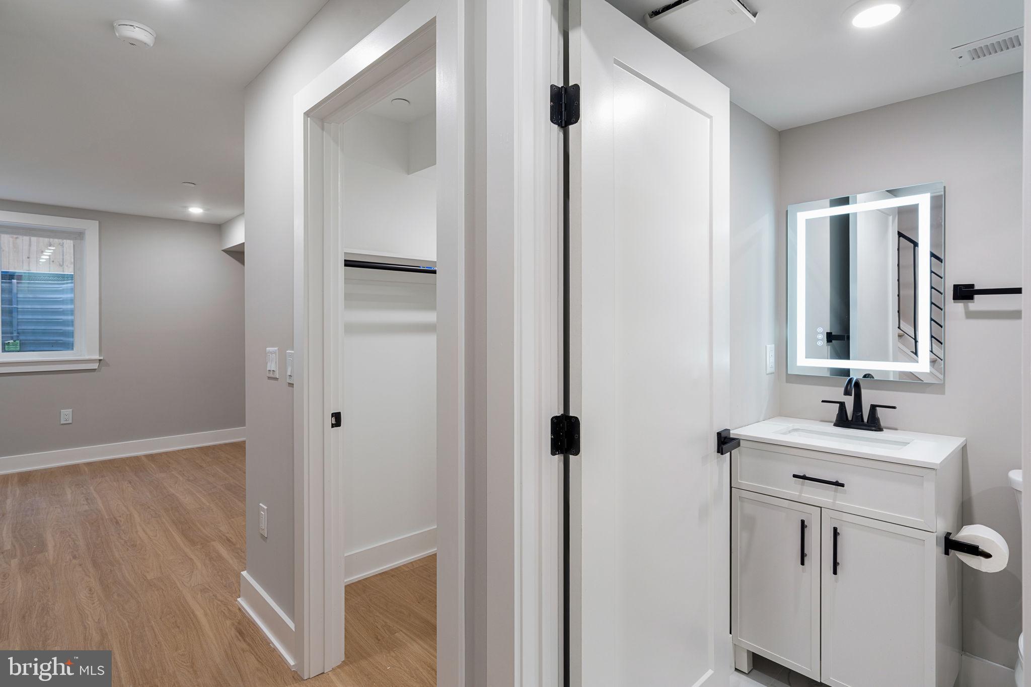 717 Mercy Street Philadelphia, PA 19148 - Photo 40 of 48 a bathroom with a double vanity sink and mirror