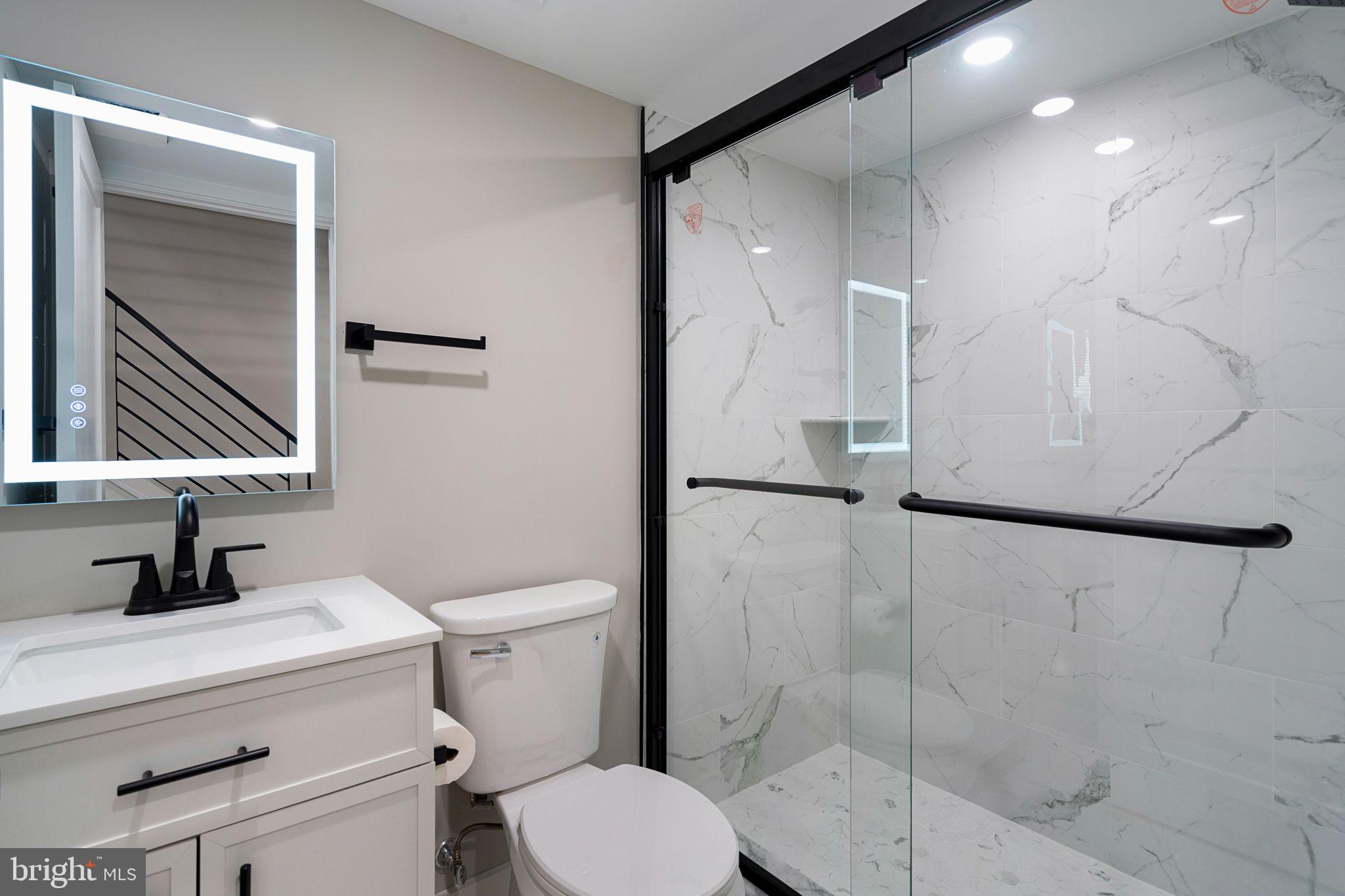 717 Mercy Street Philadelphia, PA 19148 - Photo 41 of 48 a bathroom with a sink a toilet and shower