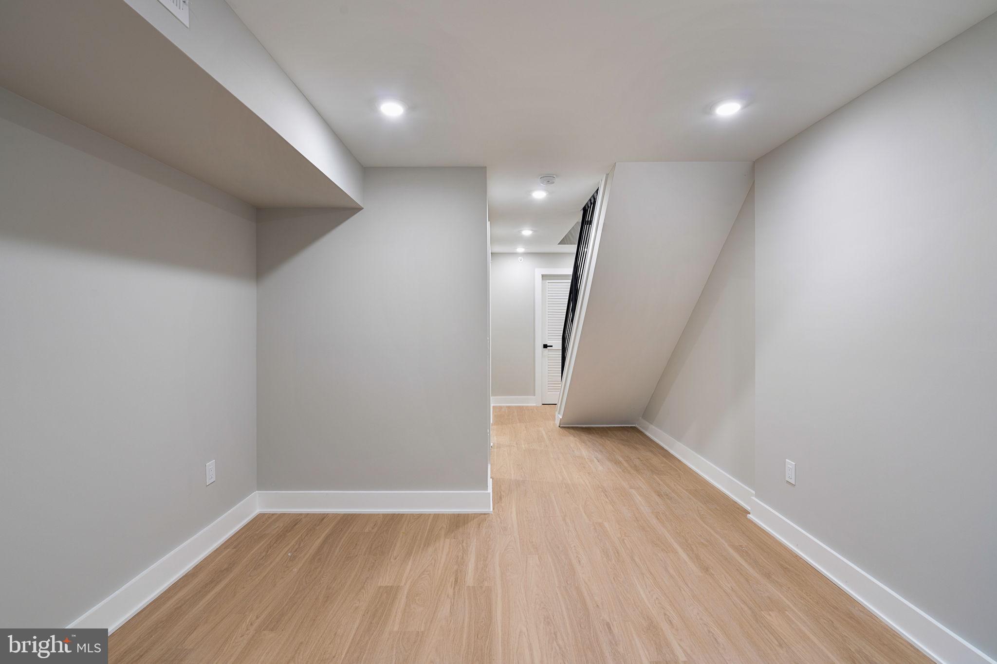 717 Mercy Street Philadelphia, PA 19148 - Photo 45 of 48 an empty room with wooden floor and natural light